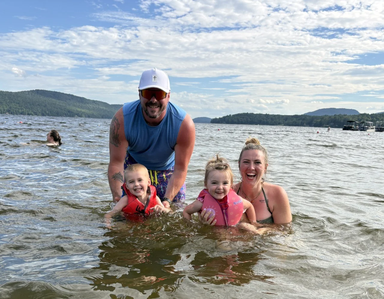 Paul and Sydney with their children enjoying time together at the lake